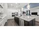 Spacious kitchen boasts granite countertops, modern appliances, and a large island at 7336 Haddington Cv, Bradenton, FL 34202