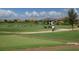 Golf course driving range with golfers at 7336 Haddington Cv, Bradenton, FL 34202