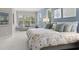 Large main bedroom with a sitting area and plush bedding, offering plenty of natural light at 7336 Haddington Cv, Bradenton, FL 34202