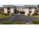 Two-story condo with carport and landscaping at 1712 Lakeside Dr # 1712B, Venice, FL 34293