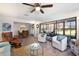 Spacious living room with a view, comfortable seating and ceiling fan at 1712 Lakeside Dr # 1712B, Venice, FL 34293