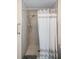 Clean shower with tile surround and glass door at 1712 Lakeside Dr # 1712B, Venice, FL 34293