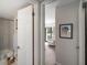 View of bathroom with doors to bedroom and patio at 1712 Lakeside Dr # 1712B, Venice, FL 34293