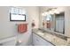 Updated bathroom with granite countertop, shower, and toilet at 1712 Lakeside Dr # 1712B, Venice, FL 34293