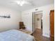 Bedroom with a queen bed, chair, and access to kitchenette at 1712 Lakeside Dr # 1712B, Venice, FL 34293