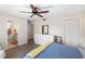 Bedroom with a queen bed, ceiling fan, dresser, and access to bathroom at 1712 Lakeside Dr # 1712B, Venice, FL 34293