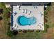 Top-down view of kidney-shaped community pool at 1712 Lakeside Dr # 1712B, Venice, FL 34293
