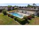 Inviting kidney-shaped community pool with surrounding patio at 1712 Lakeside Dr # 1712B, Venice, FL 34293