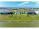 Community overview showcasing homes with pools and lake views at 14359 Skipping Stone Loop, Parrish, FL 34219