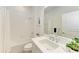 Clean bathroom with white tile, bathtub, and quartz countertop at 14359 Skipping Stone Loop, Parrish, FL 34219