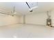 Spacious garage with epoxy flooring and overhead storage at 14359 Skipping Stone Loop, Parrish, FL 34219