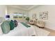 Serene main bedroom with king-size bed and sitting area at 14359 Skipping Stone Loop, Parrish, FL 34219