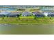 Community overview featuring houses, lake, and landscaping at 14359 Skipping Stone Loop, Parrish, FL 34219