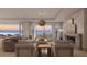 Living room with fireplace and ocean view at 70 Avenida Veneccia # 401, Sarasota, FL 34242