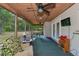 Screened porch with outdoor furniture and ceiling fan at 15440 County Road 675, Parrish, FL 34219