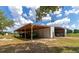 Spacious barn with covered parking for farm equipment at 15440 County Road 675, Parrish, FL 34219