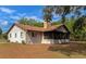 Single story home with screened porch and stone chimney at 15440 County Road 675, Parrish, FL 34219