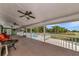 Large screened porch with ceiling fans, offering tranquil views at 15440 County Road 675, Parrish, FL 34219