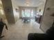 Elegant dining room with a large window and tile floors at 15440 County Road 675, Parrish, FL 34219