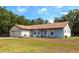Single-story home with attached garage and landscaped yard at 15440 County Road 675, Parrish, FL 34219