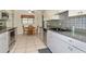 Bright kitchen with stainless steel appliances and tile flooring at 15440 County Road 675, Parrish, FL 34219