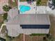 House with solar panels, pool, and backyard at 15440 County Road 675, Parrish, FL 34219