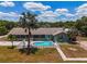 Aerial view of a home with pool and large lot, showcasing the property's size and features at 15440 County Road 675, Parrish, FL 34219