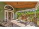 Inviting front porch with a porch swing and comfortable seating at 15440 County Road 675, Parrish, FL 34219
