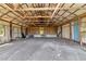 Open barn interior with exposed wooden beams and ample storage space at 15440 County Road 675, Parrish, FL 34219