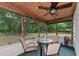 Enjoyable screened porch with table and chairs at 15440 County Road 675, Parrish, FL 34219