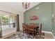 Charming dining room features an oval table and green accent wall at 15440 County Road 675, Parrish, FL 34219