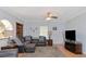 Relaxing living room with a large sectional sofa and TV at 15440 County Road 675, Parrish, FL 34219