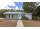 Small guest house with a quaint front porch at 15440 County Road 675, Parrish, FL 34219