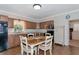 Cozy kitchen with granite countertops and wooden cabinets at 15440 County Road 675, Parrish, FL 34219