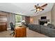 Spacious home office features built-in wooden desk and shelving at 15440 County Road 675, Parrish, FL 34219