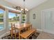 Bright breakfast nook with built-in bench seating and view of the pool at 15440 County Road 675, Parrish, FL 34219