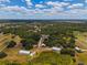Aerial view of a large property with multiple structures and vast land at 15440 County Road 675, Parrish, FL 34219