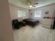 Bedroom with a queen bed and tile flooring at 15440 County Road 675, Parrish, FL 34219