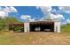 Metal barn with covered carport and space for vehicles and equipment at 15440 County Road 675, Parrish, FL 34219