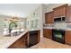 Well-equipped kitchen with granite countertops and stainless steel appliances at 15440 County Road 675, Parrish, FL 34219