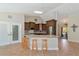 Spacious kitchen featuring an island and dark wood cabinets at 15440 County Road 675, Parrish, FL 34219