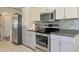 Kitchen features stainless steel appliances and updated cabinetry at 15440 County Road 675, Parrish, FL 34219
