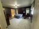 Main bedroom with ensuite bathroom and tile floors at 15440 County Road 675, Parrish, FL 34219