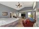 Large main bedroom with sitting area and access to outdoor patio at 15440 County Road 675, Parrish, FL 34219