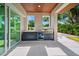 Outdoor kitchen with stainless steel appliances and built-in seating at 1805 Goldenrod St, Sarasota, FL 34239