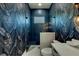 Beautiful bathroom featuring a tiled shower, and designer wallpaper at 1805 Goldenrod St, Sarasota, FL 34239