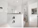 This bathroom features white walls, gray shower hardware, and a walk-in glass shower at 1805 Goldenrod St, Sarasota, FL 34239