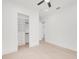 Bright bedroom featuring hardwood floors and a spacious walk-in closet with custom shelving at 1805 Goldenrod St, Sarasota, FL 34239