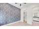 Bedroom featuring modern wall paper and en suite bathroom at 1805 Goldenrod St, Sarasota, FL 34239