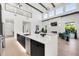 Spacious kitchen with a large island, stainless steel appliances, and a view to the living space at 1805 Goldenrod St, Sarasota, FL 34239